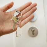 A person holding a set of keys.