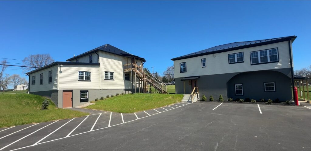 Two renovated buildings and paved parking at 15149 Bloyers Ave