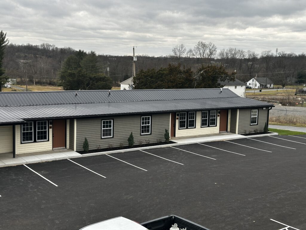 Single-story apartments and paved parking at 15149 Bloyers Ave