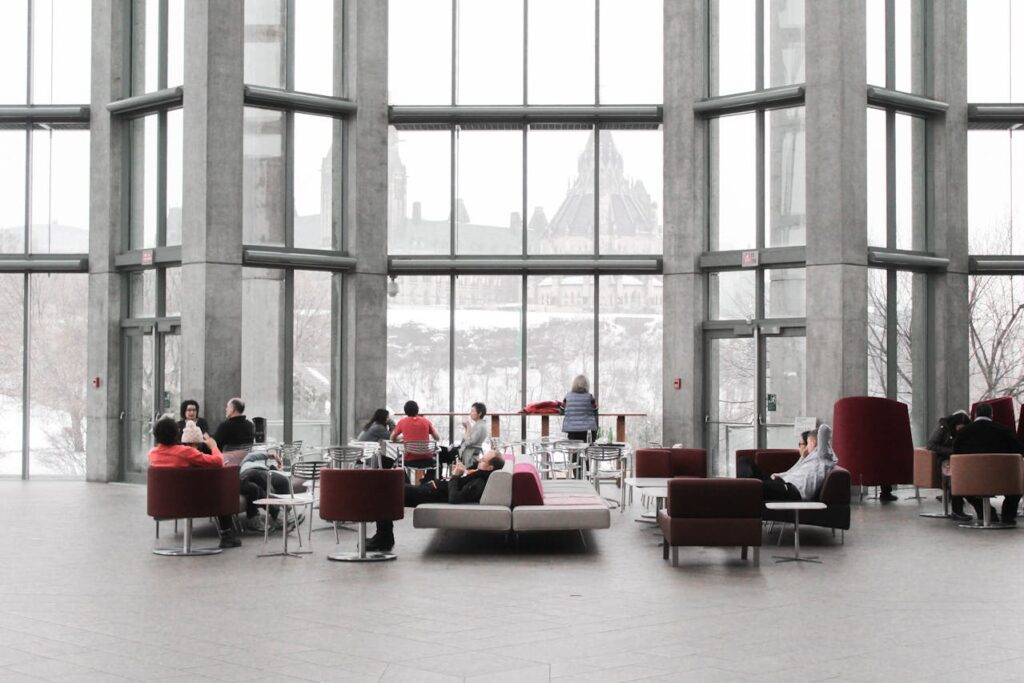 People seated inside of an office space.