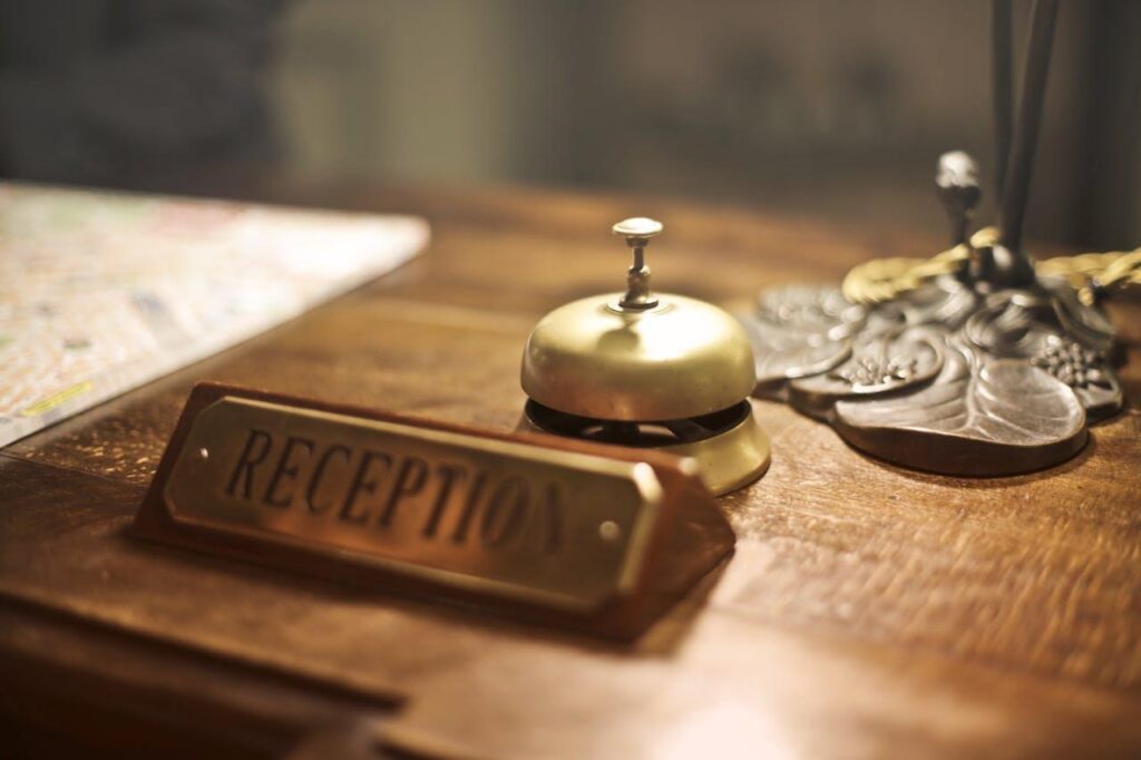 Reception desk with hotel bell.