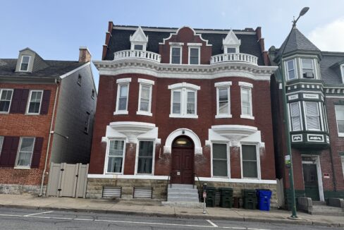 Overhead view of 130 S Potomac St, Hagerstown, showing the six-unit multi-family building, private parking area, and large rear garage in a prime downtown location.