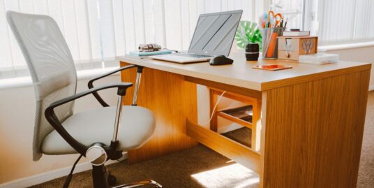 An office with wooden furniture